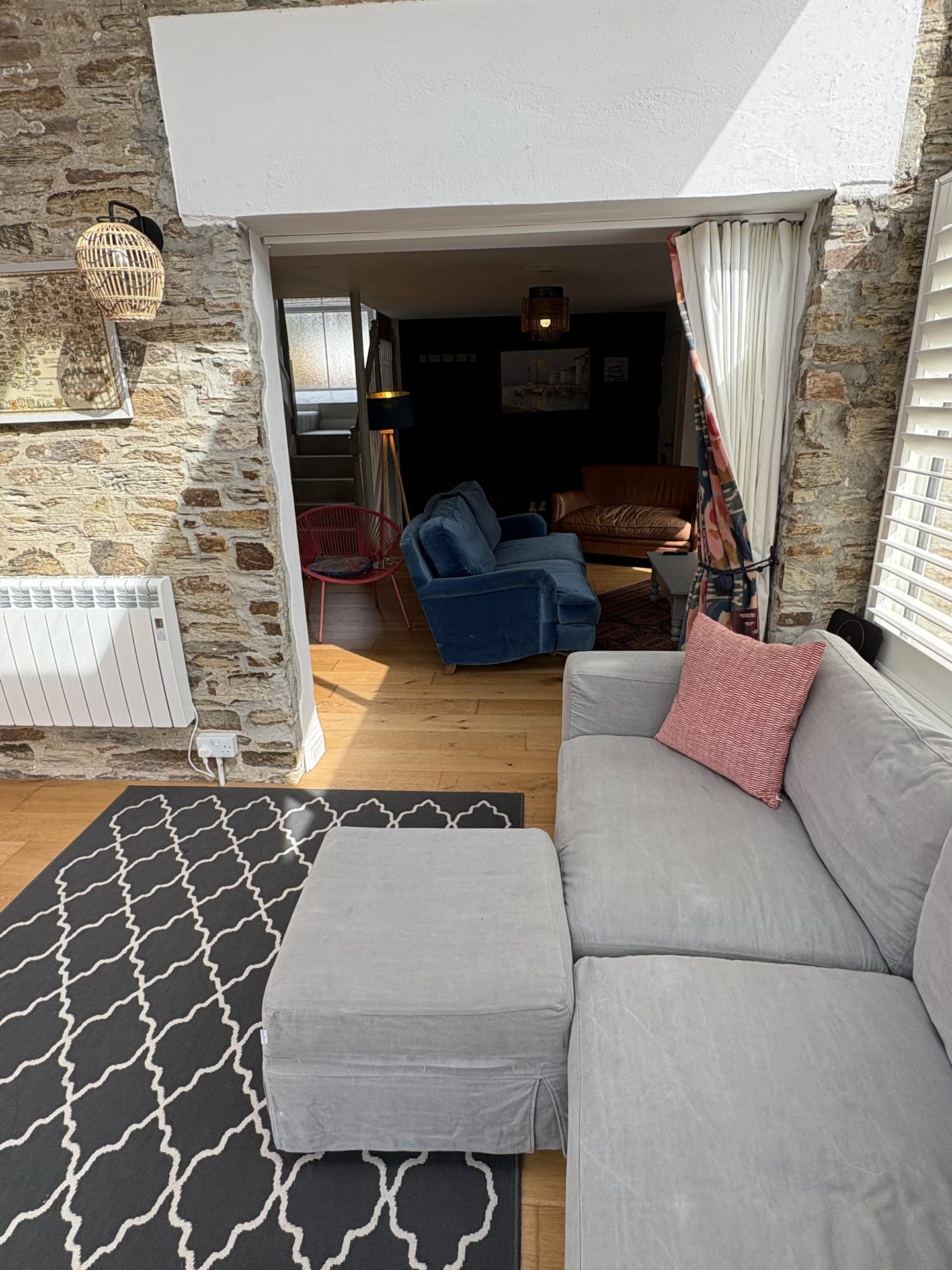 Open-plan living space with grey sofa